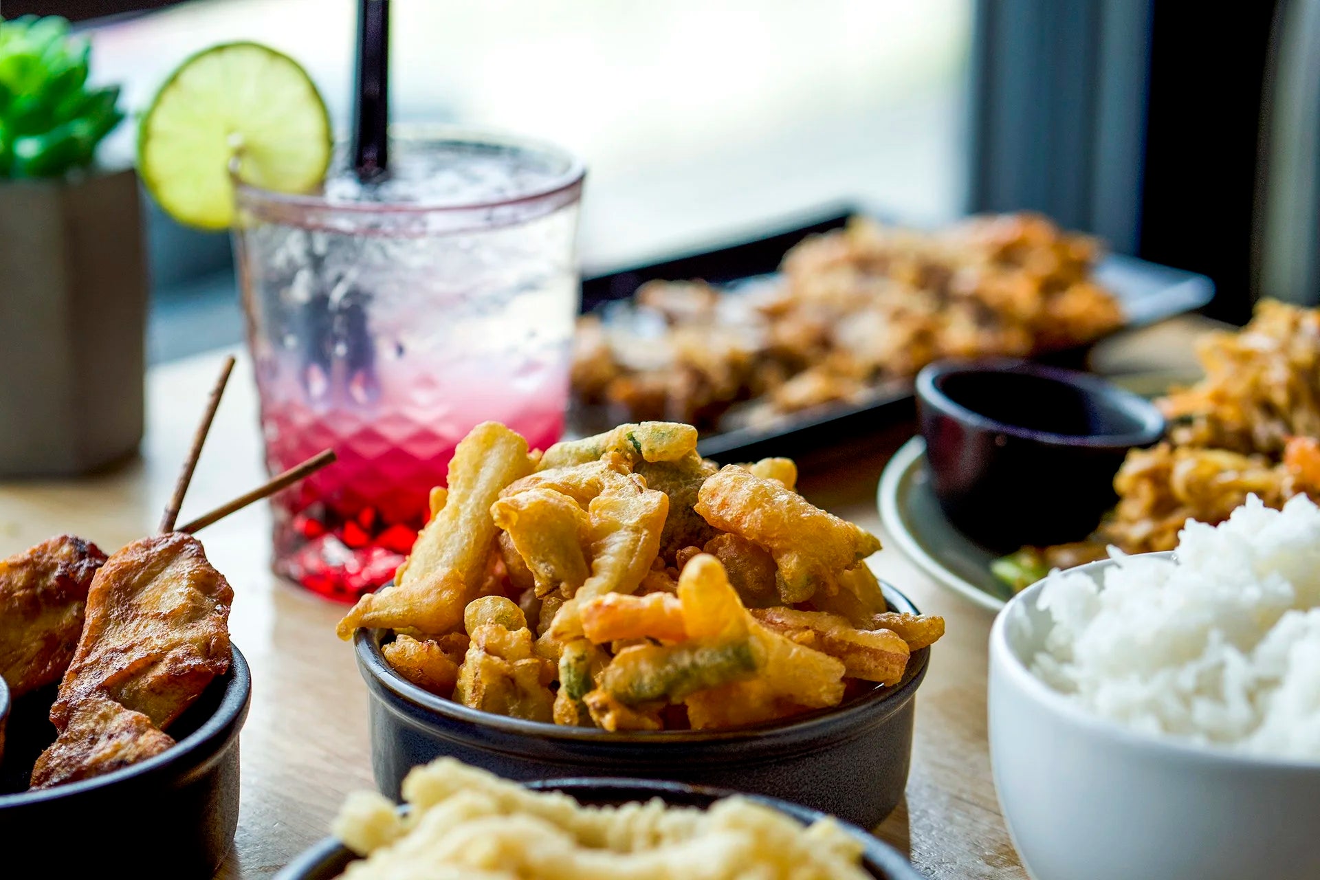 Talay Thai Kitchen - Thai tapas-style spread with cocktail