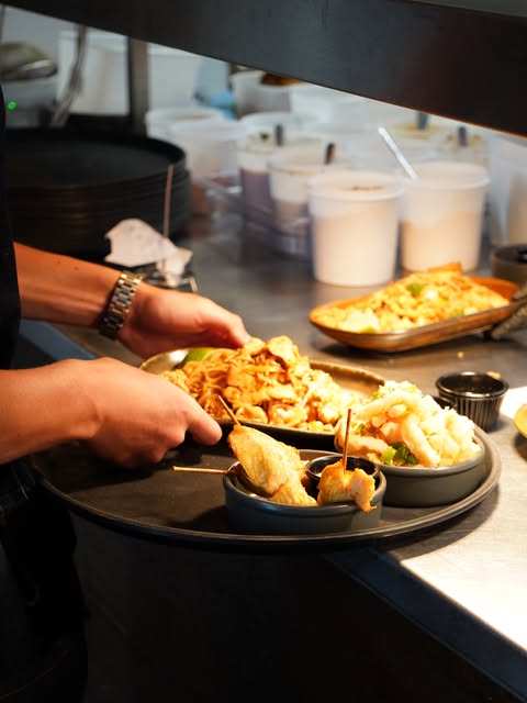 Talay Thai Kitchen kitchen plating a dish